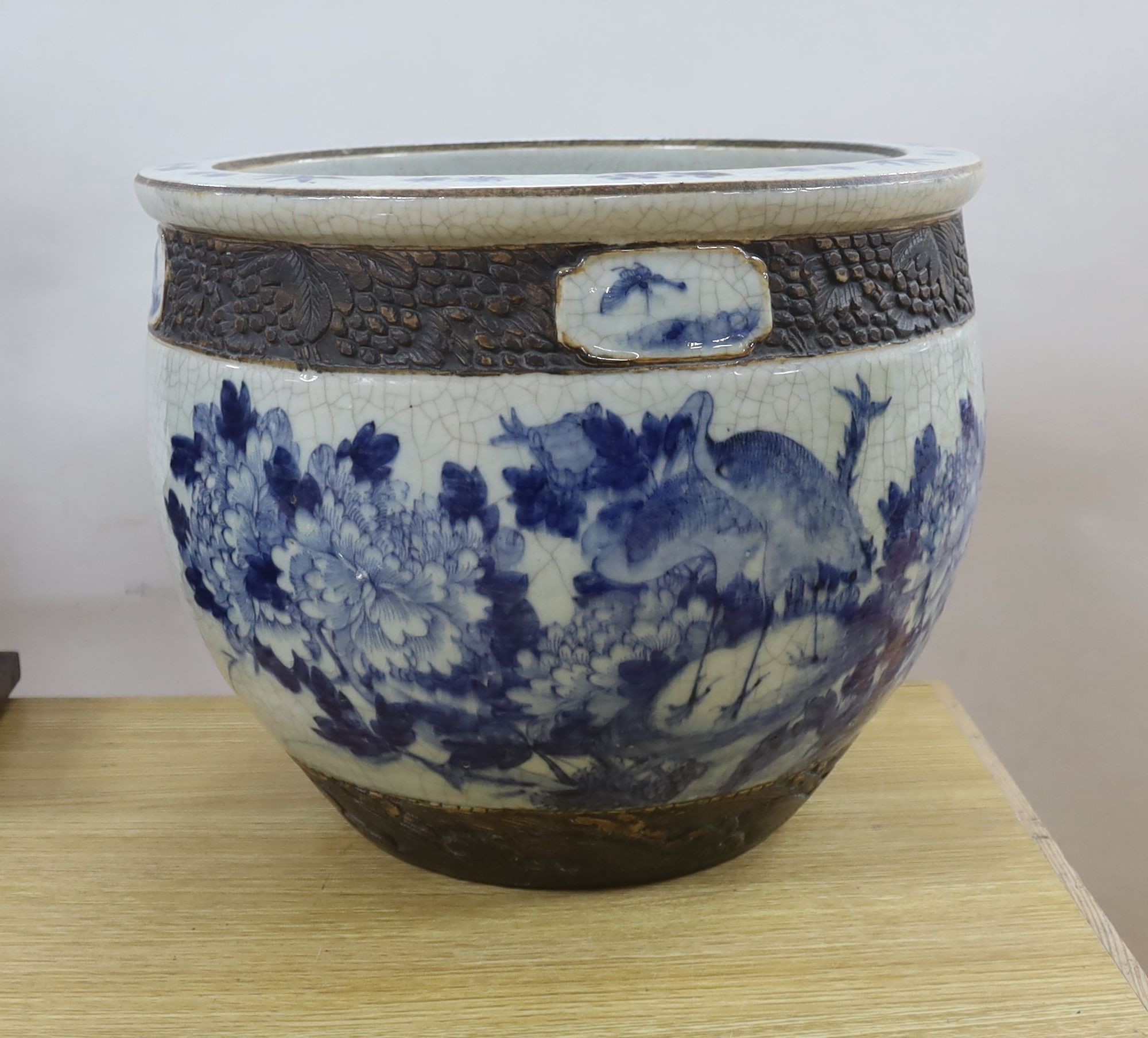 A late 19th/early 20th century Chinese blue and white crackleglaze jardiniere 30cm